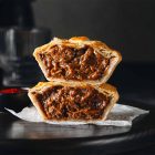 Pinjarra Bakery Chunky Pepper steak pie overflowing with tender chunks of primed steak, ground beef, and a bold, peppery flavour.